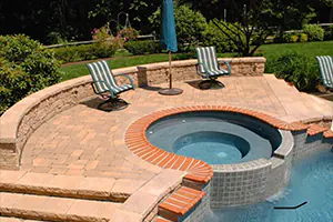 picture of a pool with a hot tub and hardscaping - DeMichele Inc Media, PA